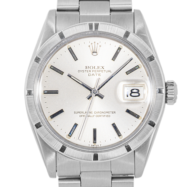 Silver Rolex watch with a white face on a white background