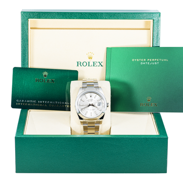 Rolex watch in a green box with accessories