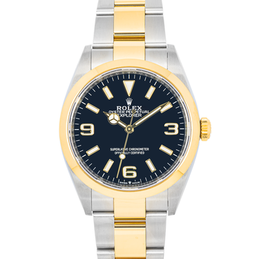 Two-tone Rolex watch with gold and silver band on a white background