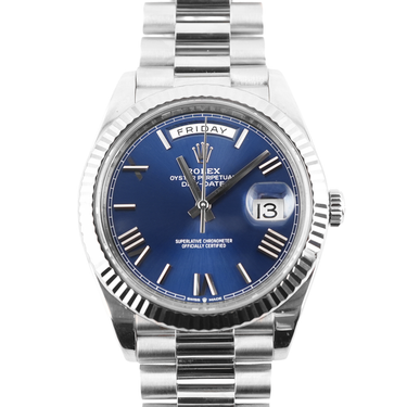 Silver watch with a blue face on a white background