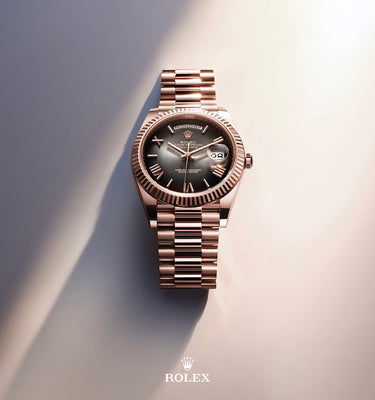 Rose gold Rolex watch on a gradient background