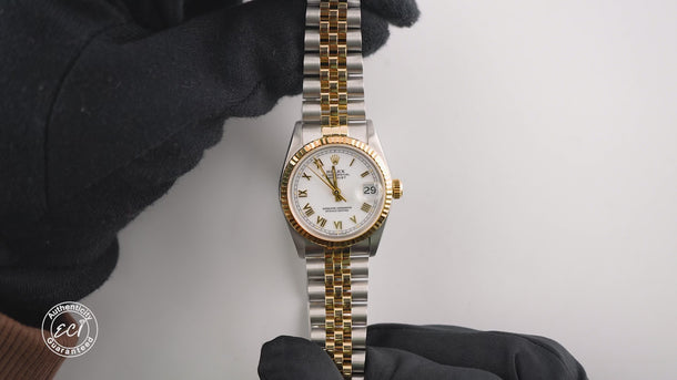Two-tone Rolex watch with silver and gold band on a white background