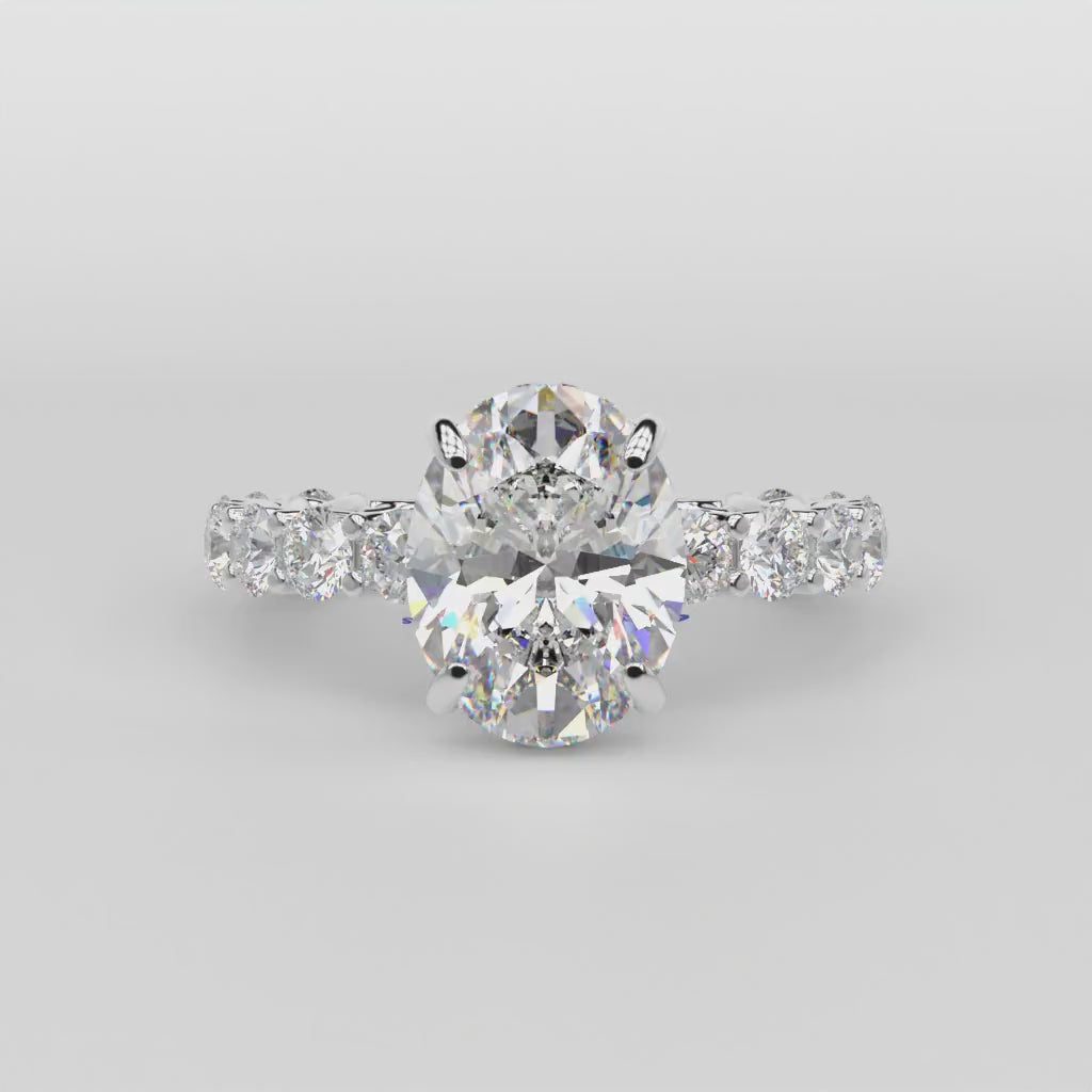 oval shape diamond ring on a white background turn table
