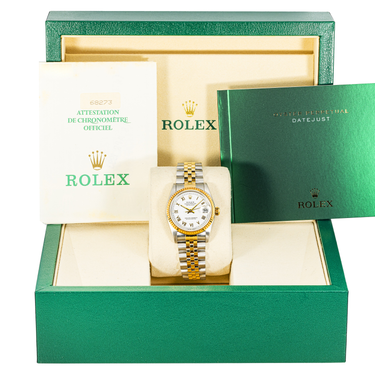 Rolex watch with gold and silver band in green box