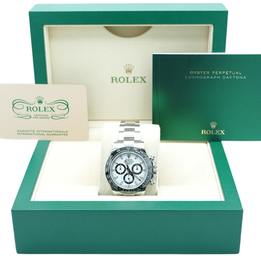 Rolex watch in a green box with branding